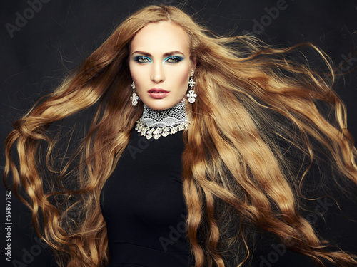 Naklejka dekoracyjna Photo of beautiful woman with magnificent hair. Perfect makeup