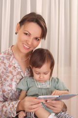 Canvas Print - Mom and daughter reading