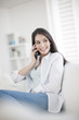 © jackfrog - Portrait of beautiful young woman talking on mobile phone