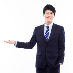 Wall Mural - Young Asian business man showing something