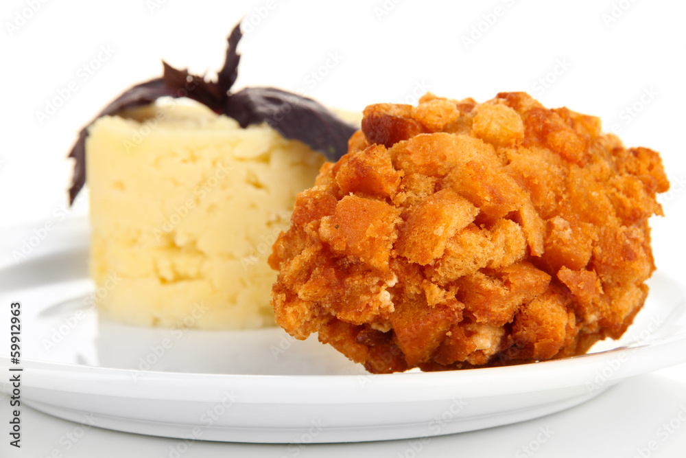 Chicken Kiev  and mashed potatoes on plate, isolated on white