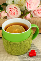 Aufkleber - Cup of tea with knitted thing on it close up