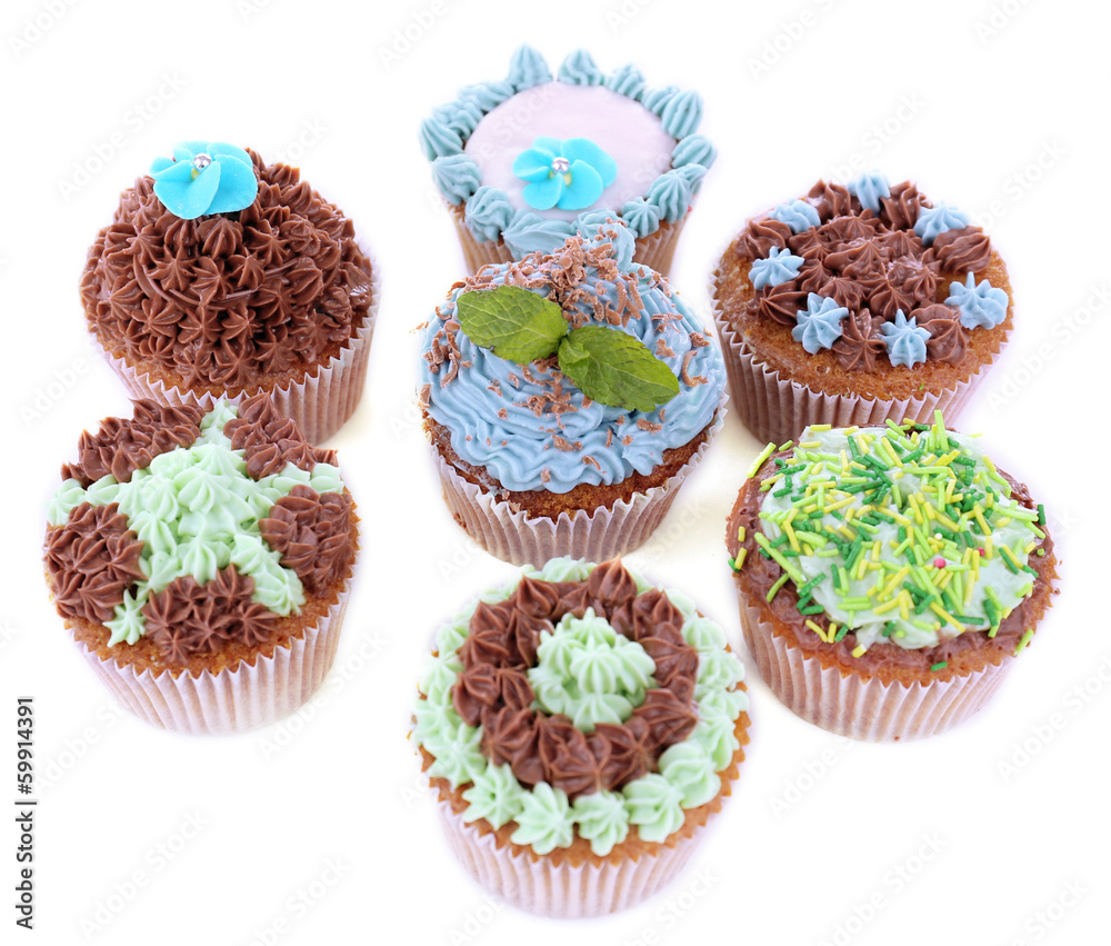 Tasty cupcakes with butter cream, isolated on white