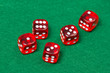 © Di Studio - five playing red dices on green table