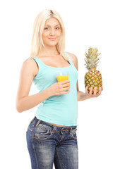 Poster - Smiling young female holding pineapple and orange juice