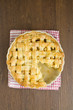 Apple pie with lattice top with slice taken