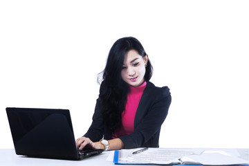 Wall Mural - Businesswoman working on a laptop