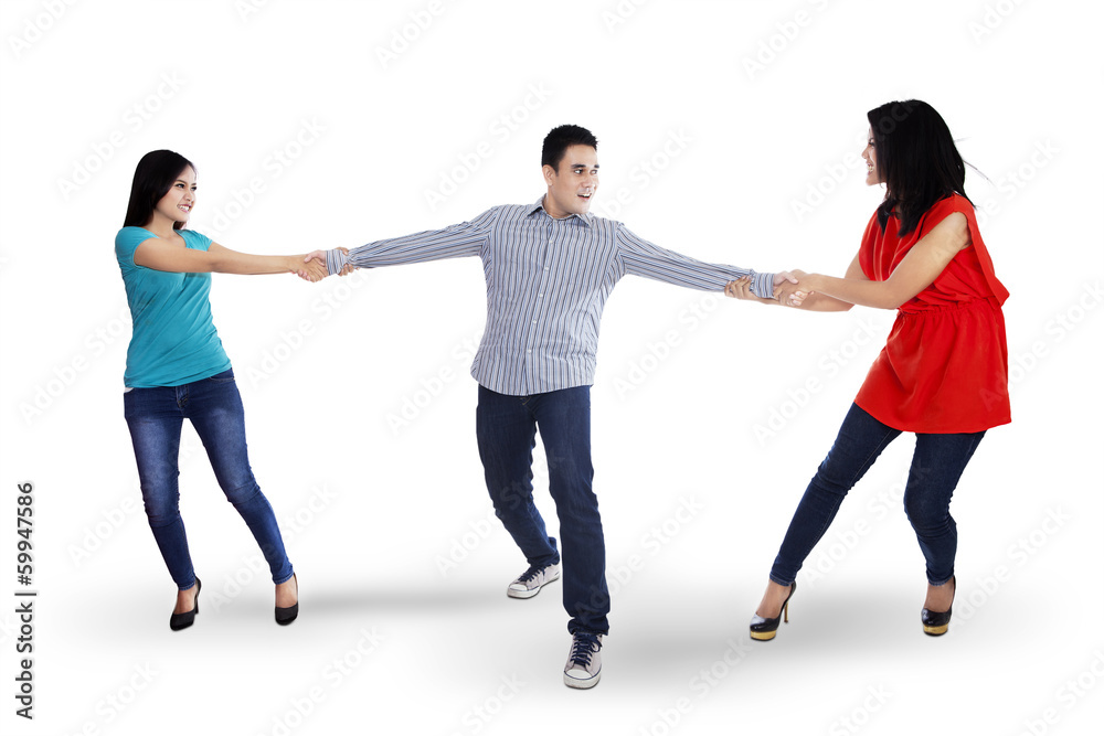 Two woman fighting for a man Stock Photo | Adobe Stock