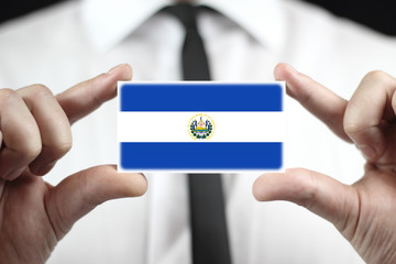 Businessman holding a business card with El Salvador Flag