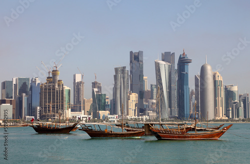 Nowoczesny obraz na płótnie Skyline of Doha with traditional arabic dhows. Qatar