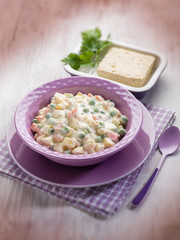 Wall Mural - russian salad with tofu cheese, selective focus