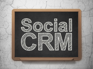 Finance concept: Social CRM on chalkboard background