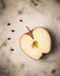Apple with seeds on  marble surface