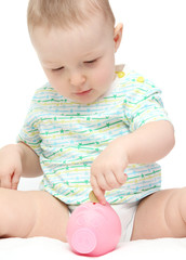 baby with piggy bank