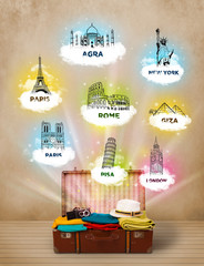 Wall Mural - Tourist suitcase with famous landmarks around the world