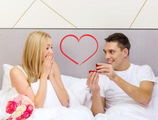 Poster - man giving woman little red box and ring in it