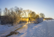 Frozen River In Winter Landscape