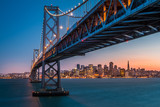 Fototapeta  - San Francisco skyline framed by the Bay Bridge at sunset