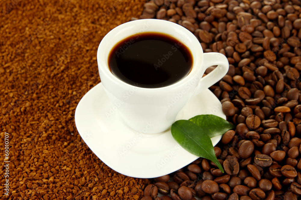 Cup of coffee on coffee background