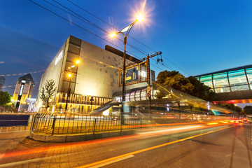 moving car with blur light through city at night