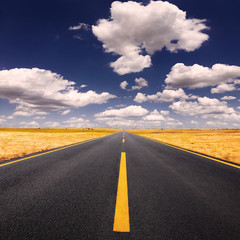 Canvas Print - Driving on asphalt road at lovely sunny day