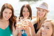 © Syda Productions - smiling girls with champagne glasses