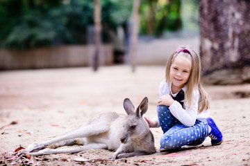 young girl and kangaroo in the zoo