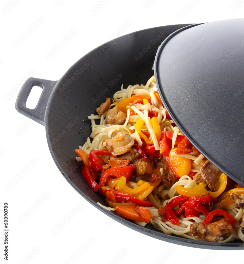 Noodles with vegetables on wok isolated on white