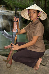 Wall Mural - Asian woman armed