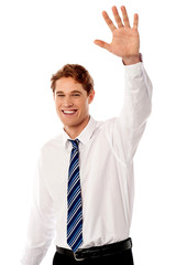 Wall Mural - Businessman waving hi to his colleague