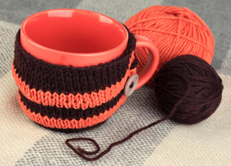 Aufkleber - Cup with knitted thing on it close up