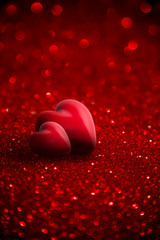 Wall Mural - two red hearts with glitter for background of valentine day