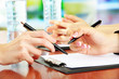 © Africa Studio - Close up of business people hands during teamwork