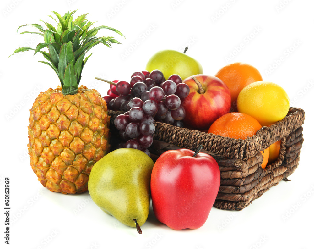 Ripe fruits in basket isolated on white