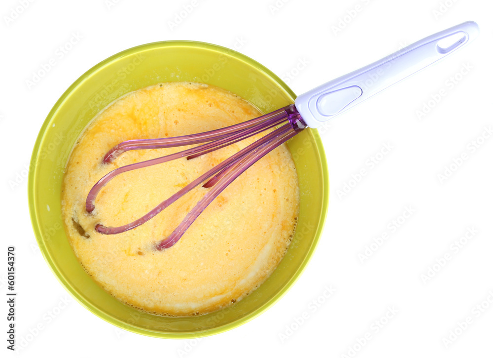 Corolla and broken eggs in bowl isolated on white