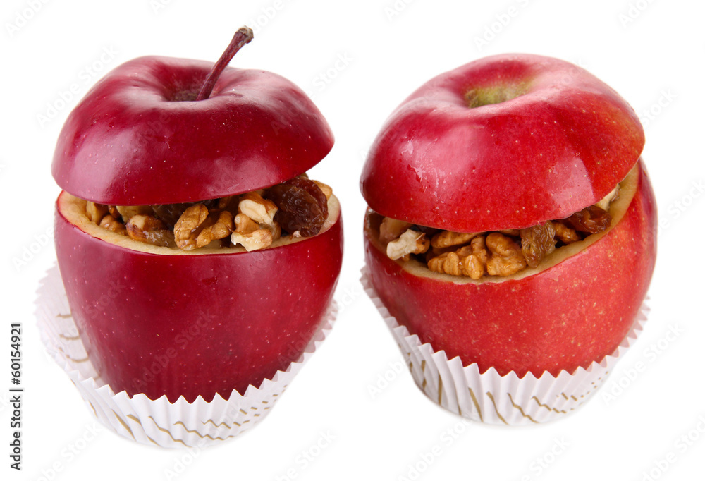 Apples with raisins and nuts isolated on white