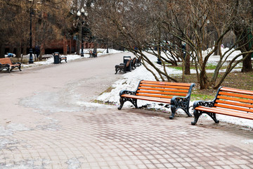 Sticker - empty wooden benches in city park