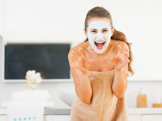 Wall Mural - Young woman with cosmetic mask on face scaring