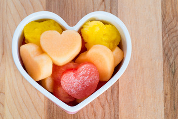 Valentines Day healthy treat with heart-shaped fruit 