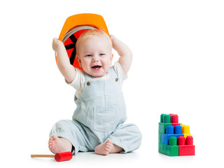 child with hard hat and building blocks