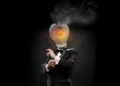 Businessman with exploded overworked lamp head on black backgrou