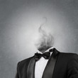 © Milles Studio - Overworked burnout business man standing headless with smoke ins