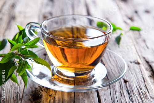 Fotografie, Obraz Transparent cup of green tea on wooden background