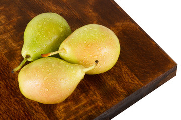 Fresh juicy water-sprinkled pears on white background