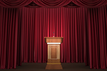 Podium and microphone in center of theatrical stage