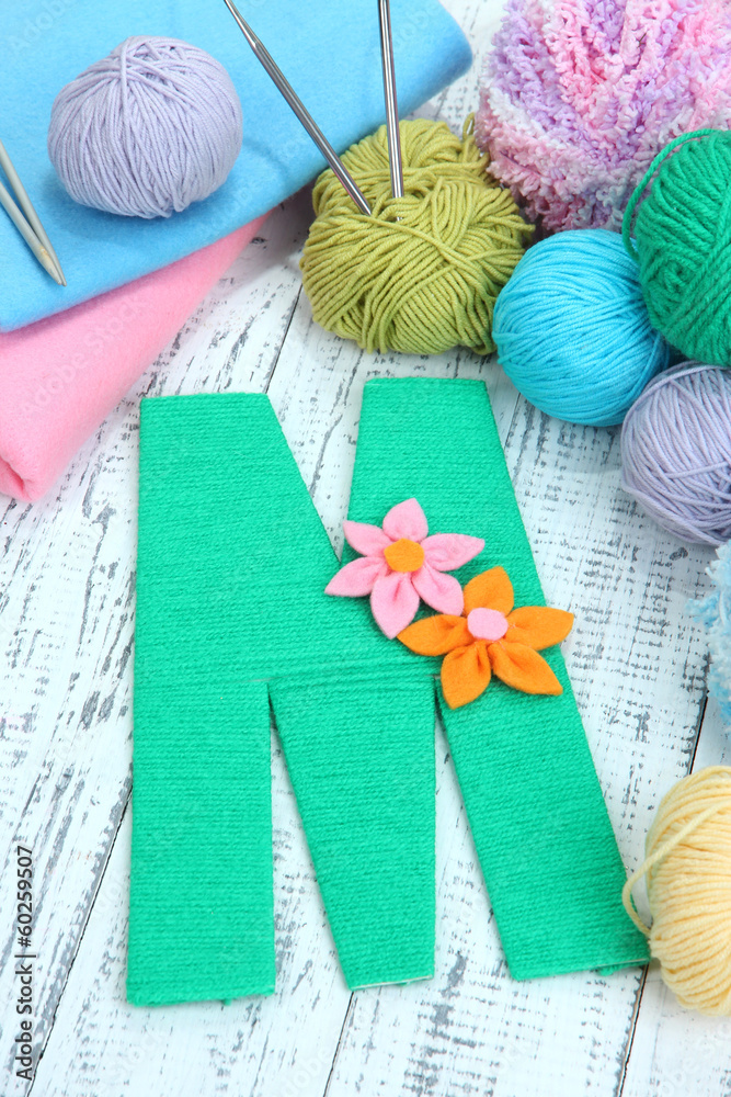 One letter of knit handmade alphabet close up