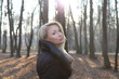 © neonshot - Attractive lady posing in park.