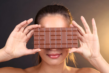 Wall Mural - Portrait of beautiful young girl with chocolate