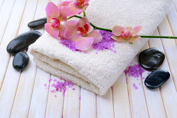 Poster - Still life with beautiful blooming orchid flower, towel and