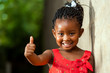 © karelnoppe - Pretty little african girl showing thumbs up.